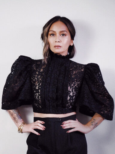 VINTA High Neck Pleat Front Camisa in Black, Styled with High Waisted Black Pants, Models Hands on Hips