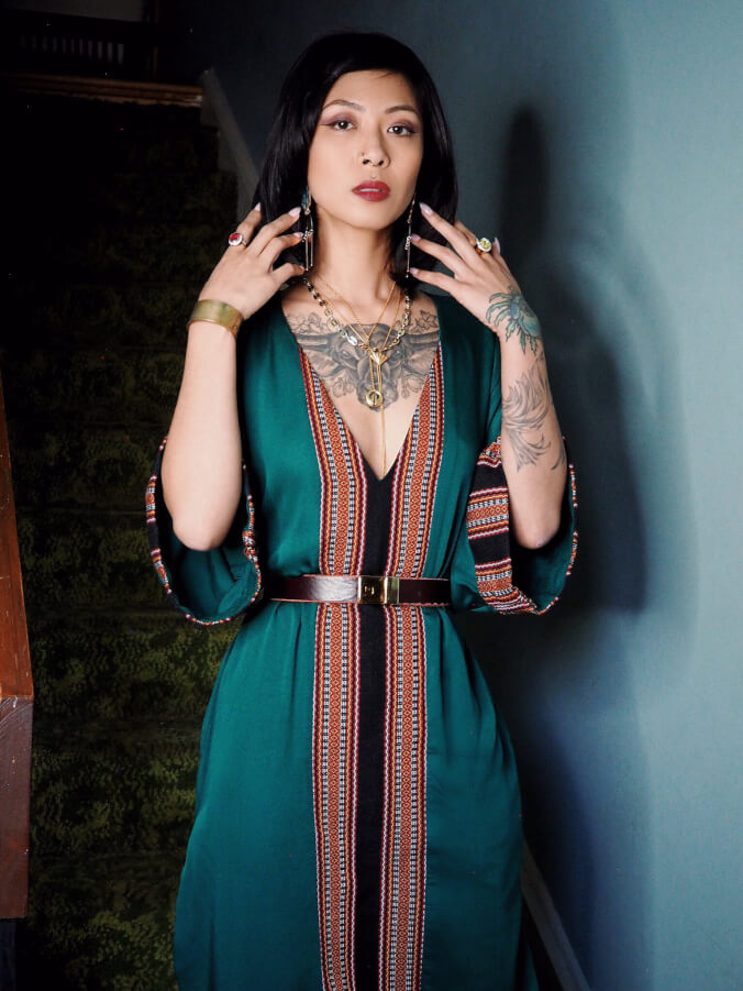 VINTA Kaftan in Emerald Green; cinched at waist with belt and worn with VINTA Lingling-O Lariat.